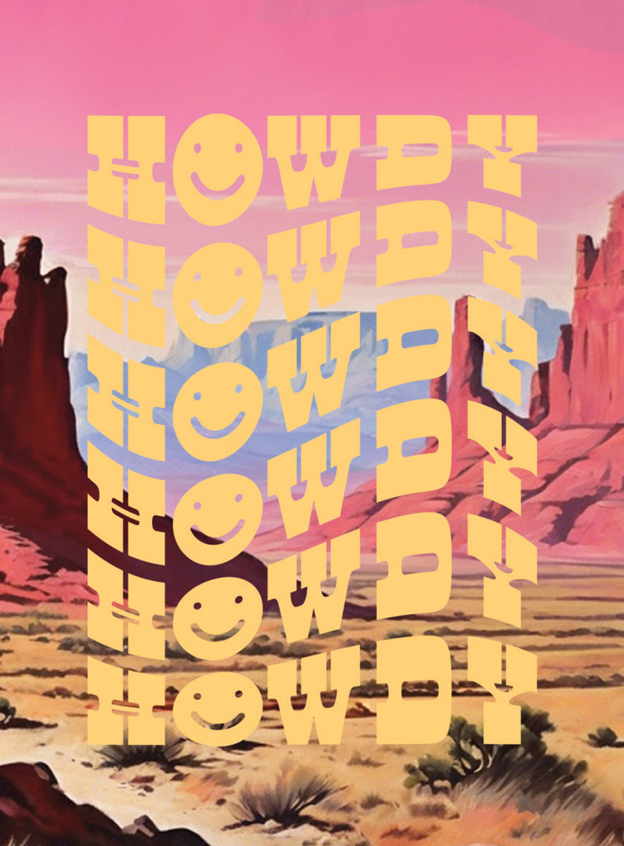 A decorative 'Howdy' magnet with multiple yellow wavy 'Howdy' texts, each 'H' replaced with a smiley face, set against a vibrant desert landscape with red rocks, cacti, and a pink and blue sky.