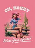 Sassy pin-up cowgirl magnet featuring a woman in a pink cowboy hat, tied denim shirt, and cutoff shorts, sitting on a wooden fence in a desert landscape with saguaro cacti, on a vibrant pink background. The text 'Oh, Honey, Bless Your Heart!' is displayed in a western font. Perfect retro gift for her.
