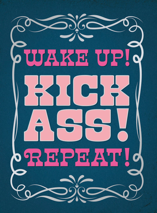 A bold blue magnet with the motivational phrase "WAKE UP! KICK ASS! REPEAT!" in vibrant pink text, framed by ornate white scrolls.