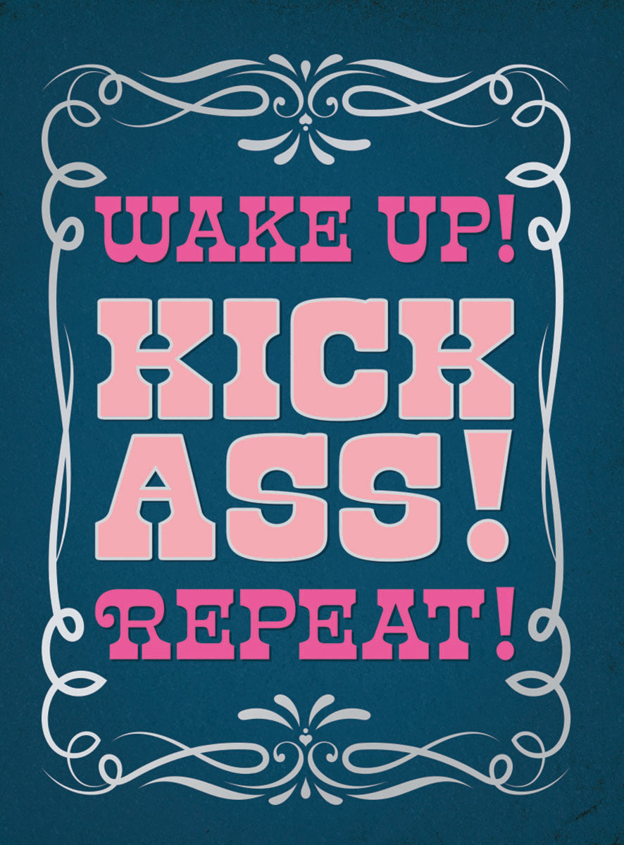 Motivational magnet featuring bold pink text 'WAKE UP! KICK ASS! REPEAT!' on a deep blue distressed background, elegantly framed by intricate white scrollwork. Inspiring daily reminder for focus and drive.