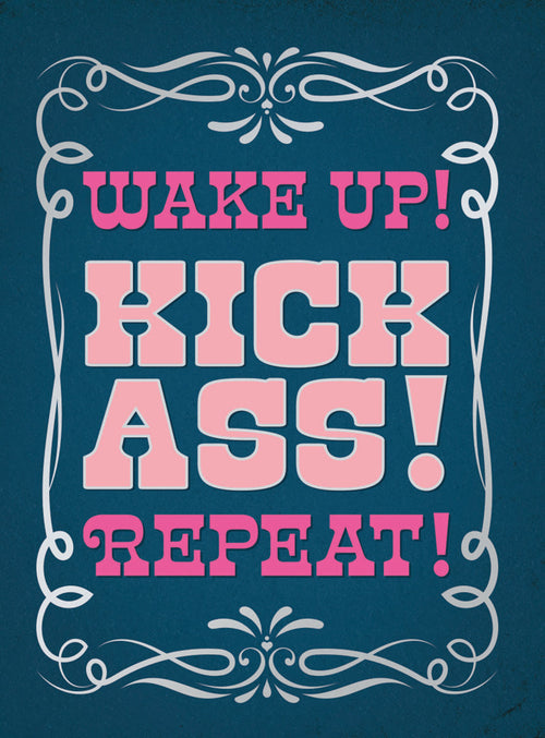 Motivational magnet featuring bold pink text 'WAKE UP! KICK ASS! REPEAT!' on a deep blue distressed background, elegantly framed by intricate white scrollwork. Inspiring daily reminder for focus and drive.