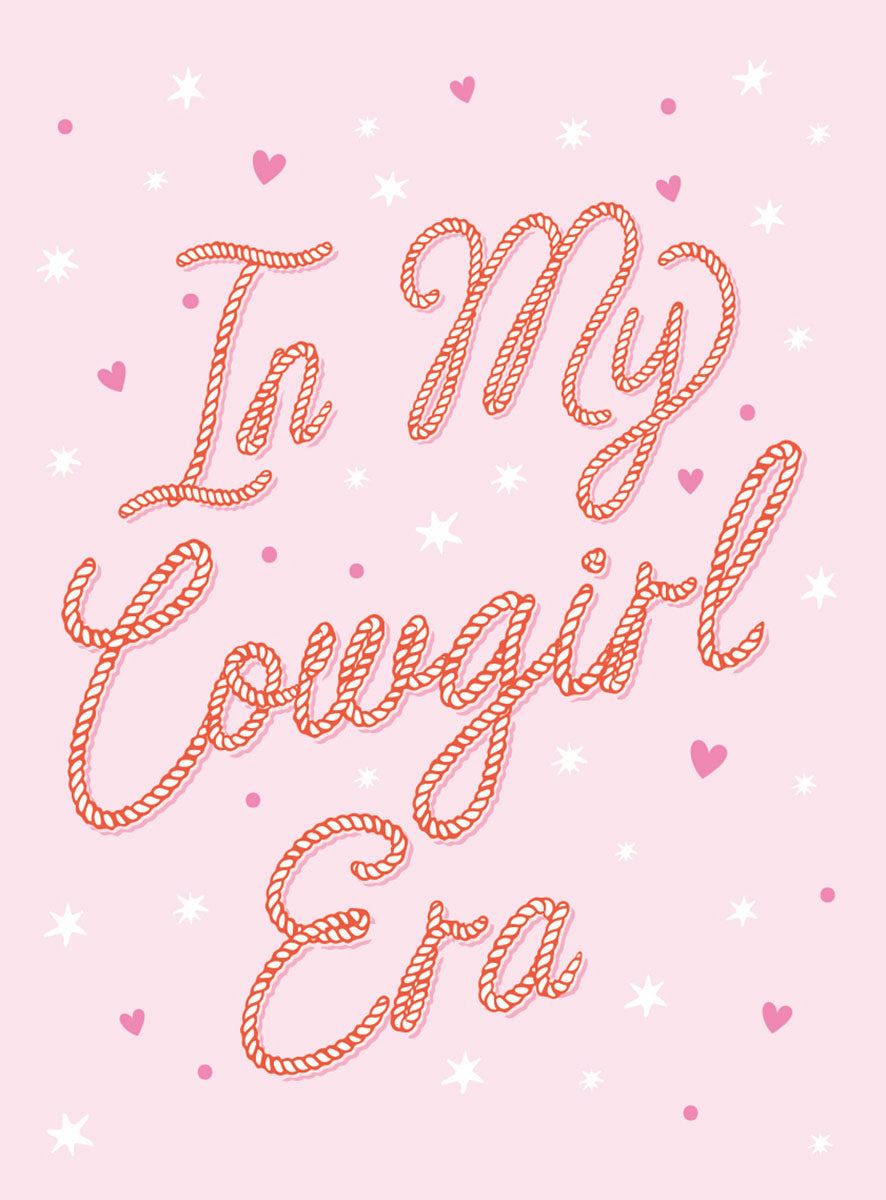 Pink 'In My Cowgirl Era' magnet with rope-style script, surrounded by white stars and small pink hearts, perfect for trendy decor.