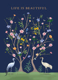 Decorative magnet featuring 'LIFE IS BEAUTIFUL' text, colorful trees with pink, yellow, blue flowers, green leaves, blue jay, pink birds, butterflies, and two elegant cranes against a dark blue background. Perfect for nature lovers and inspirational gifts.