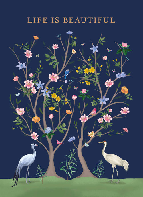 Vibrant magnet featuring two crane birds, colorful flowering trees with butterflies, and songbirds, set against a deep blue background with 'Life is Beautiful' text.