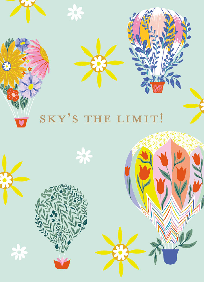 Vibrant hot air balloon magnet with 'SKY'S THE LIMIT!' text on a light blue background. Features whimsical floral and botanical designs in yellow, pink, blue, and green, surrounded by star-like flowers, perfect for encouragement.
