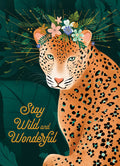 Illustration of a majestic leopard wearing a colorful flower crown amidst lush jungle foliage, with the empowering text 'Stay Wild and Wonderful'. Ideal as a magnet for inspiration and positive vibes.