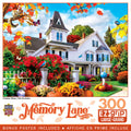 300-piece EZ-grip jigsaw puzzle depicting a charming white Victorian house with a spire, surrounded by vibrant autumn foliage, red mums, yellow chrysanthemums, pumpkins, a squirrel on a tree branch, and bluebirds, under a bright blue sky.
