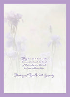 Inside of a thoughtful sympathy card with a soft purple border, displaying a tender message 'They live on in the hearts, the memories, and the lives of those who were blessed to know and love them. Thinking of You With Sympathy.' against a faint floral background.