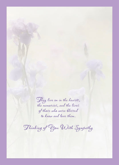Inside of a sympathy card with soft purple irises and message: 'They live on in the hearts, the memories...' with 'Thinking of You With Sympathy.'