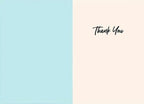 Inside of a thank you greeting card, showing a blank light blue panel on the left and a light pink panel on the right. Elegant script 'Thank You' is printed on the right side, leaving ample space for a personalized, handwritten message.