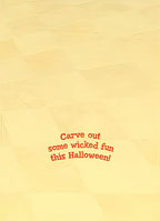 Inside view of a humorous greeting card with the message 'Carve out some wicked fun this Halloween!' in red text on a light yellow background.