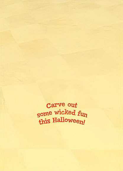 Inside of a light yellow greeting card with bold red text: 'Carve out some wicked fun this Halloween!'.