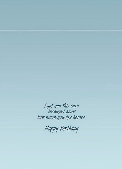 Inside of a light blue greeting card with black cursive text: 'I got you this card because I know how much you like horses. Happy Birthday.'