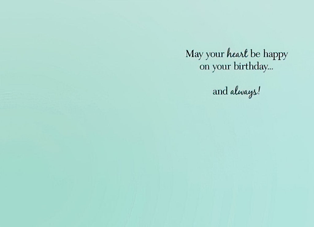 Inside of a serene teal-colored birthday card with elegant black script reading 'May your heart be happy on your birthday... and always!' conveying a warm and lasting wish for happiness.