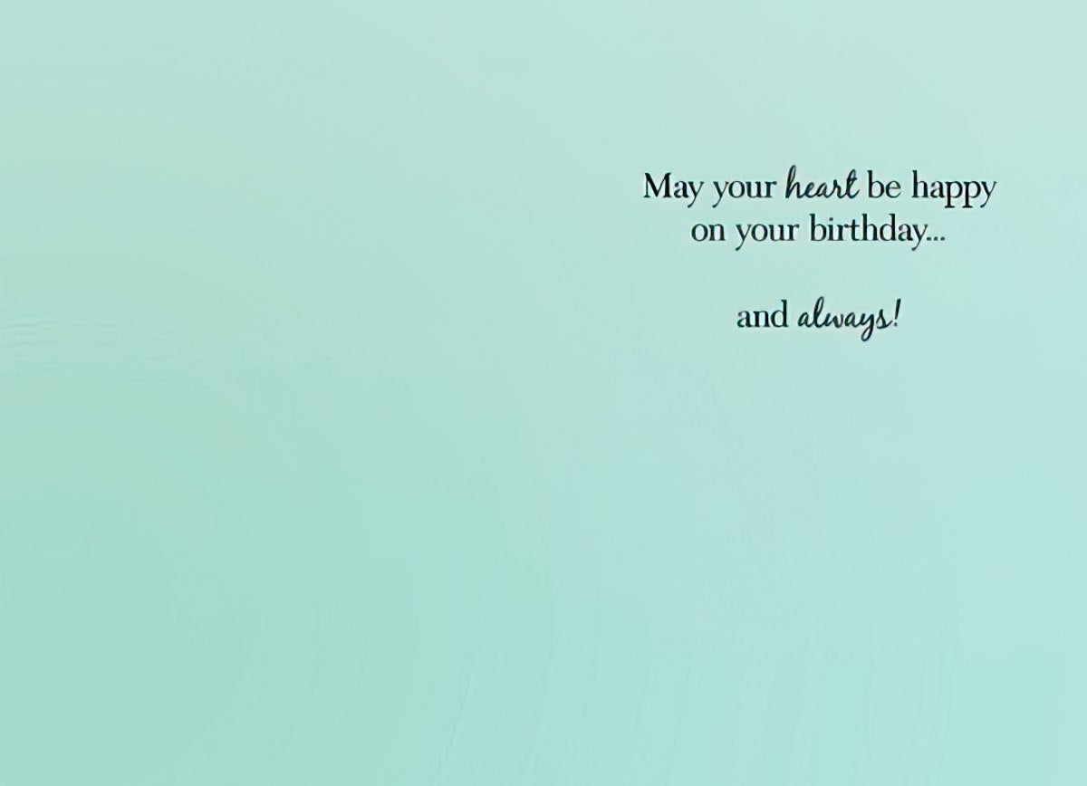 Inside of a serene teal-colored birthday card with elegant black script reading 'May your heart be happy on your birthday... and always!' conveying a warm and lasting wish for happiness.