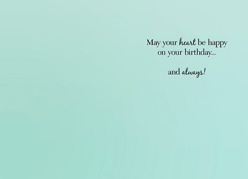 Inside of a thoughtful greeting card with a serene teal background, wishing 'May your heart be happy on your birthday... and always!'