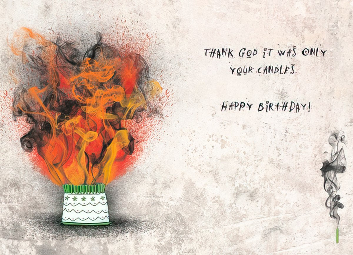Inside of a funny birthday card showing an illustrated cake with many glowing, burning candles, emitting dramatic smoke and flames. Text reads "THANK GOD IT WAS ONLY YOUR CANDLES. HAPPY BIRTHDAY!" The background is a textured, light-colored wall.
