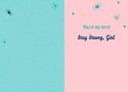 Inside of a cancer support greeting card. Left side is blank light blue. Right side features light pink background with small hearts and butterflies, and the message 'You're my hero! Stay Strong, Girl' in elegant blue script.