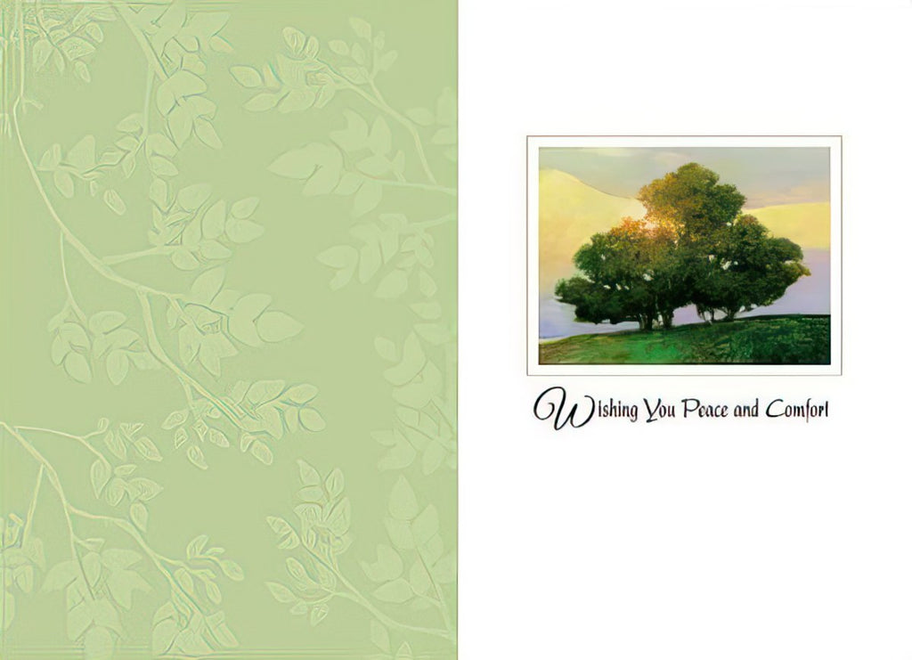 Inside of a religious comfort card, showing a vibrant green tree under a golden sky and the message 'Wishing You Peace and Comfort' on a light green leafy background.