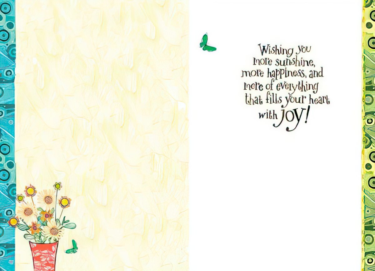 Inside of a birthday card with a light yellow background, a vase of flowers, and a message 'Wishing you more sunshine, more happiness, and more of everything that fills your heart with joy!'