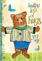 Cute bear get well card front, featuring an adorable brown bear in a striped shirt, ready for a hug, with blue butterflies and encouraging 'Sending lots of hugs your way' message. Perfect for a child.