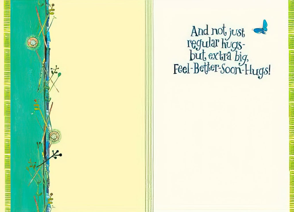 Inside of an encouraging greeting card for kids, with text 'And not just regular hugs - but extra big, Feel-Better-Soon-Hugs!' against a pale yellow background with green border.
