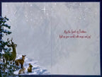 Inside view of a heartfelt holiday card, displaying a faint winter animal scene and the message 'May the Spirit of Christmas light up your world with magic and joy!'