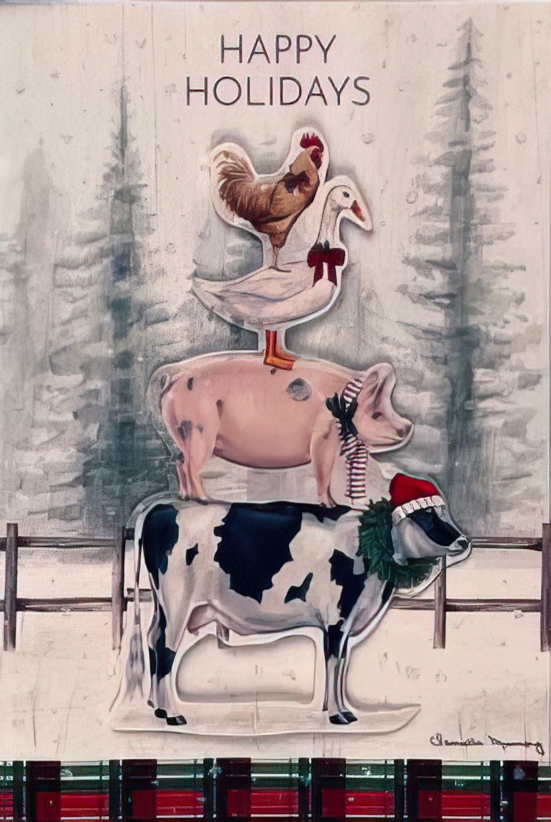 Front of a festive greeting card featuring a whimsical stack of farm animals: a cow with a Santa hat and wreath, a pig with a scarf, a goose with a bow, and a rooster on top, against a snowy winter forest backdrop. Text reads 'Happy Holidays'.