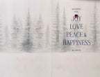 Inside of a holiday greeting card displaying a serene snowy winter forest scene with tall pine trees. The text in elegant font reads 'WISHING YOU JOY LOVE PEACE & HAPPINESS ALWAYS!'.