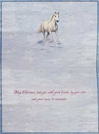 Inside of a snowy horse-themed greeting card, displaying a beautiful white horse running in the snow and the heartfelt message: 'May Christmas find you with good friends by your side and good times to remember.' Ideal for holiday messages.