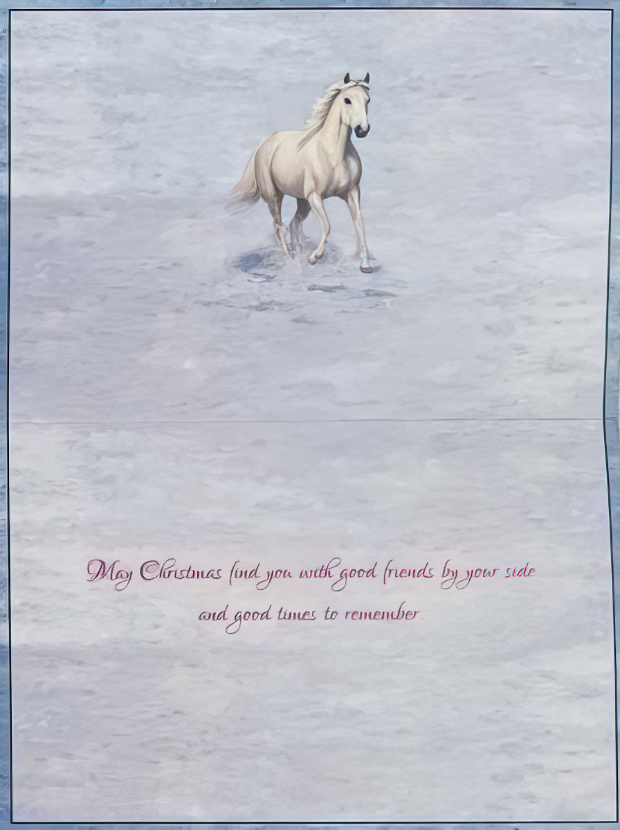 Inside of a snowy horse-themed greeting card, displaying a beautiful white horse running in the snow and the heartfelt message: 'May Christmas find you with good friends by your side and good times to remember.' Ideal for holiday messages.