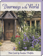 Front cover of 'Doorways to the World' blank greeting card assortment by Scanlan Portfolio, featuring an inviting rustic stone doorway with a wooden door and lush purple and white flowers.