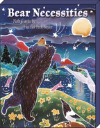 Close-up of the box cover for 'Bear Necessities Note Cards by Harriet Peek Taylor,' featuring a whimsical illustration of a black bear reaching towards a full moon in a night sky with stars, birds, and flowers.