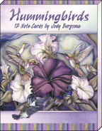 Close-up of the 'Hummingbirds 12 Note Cards by Jody Bergsma' box, showcasing a vibrant watercolor illustration of hummingbirds around purple petunias.