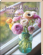 SEO-optimized alt description for an elegant greeting card showcasing three soft pink ranunculus blossoms arranged over vintage sheet music, perfect for a floral blank note card set.