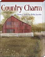 Close-up of the 'Country Charm Note Cards by Billy Jacobs' box cover, featuring a red barn with an American flag design and a white fence in a scenic countryside setting.