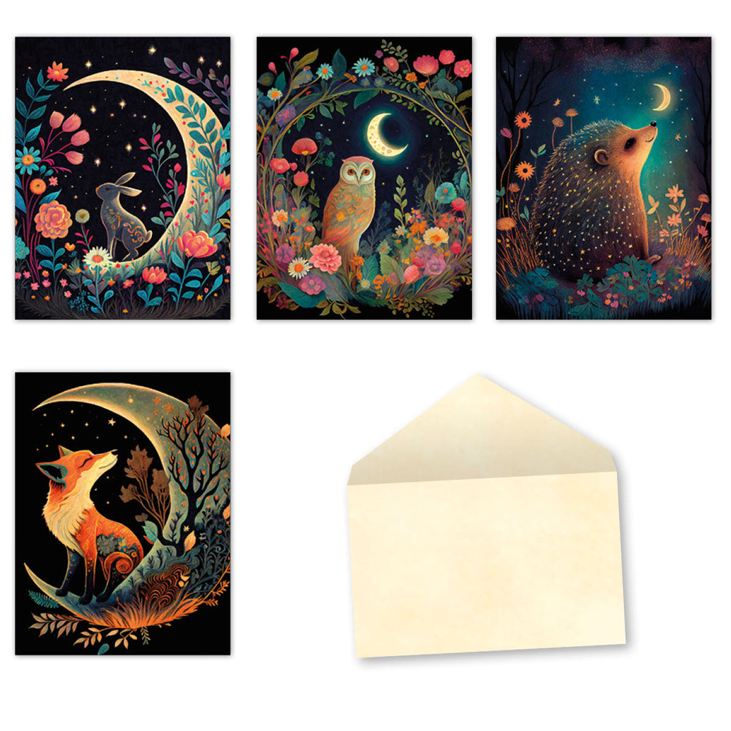 An assortment of four whimsical greeting cards and a blank cream envelope. Each card features a different woodland animal (rabbit, owl, hedgehog, fox) under a glowing crescent moon, surrounded by vibrant flowers and starry night skies. Designs are artistic and colorful.