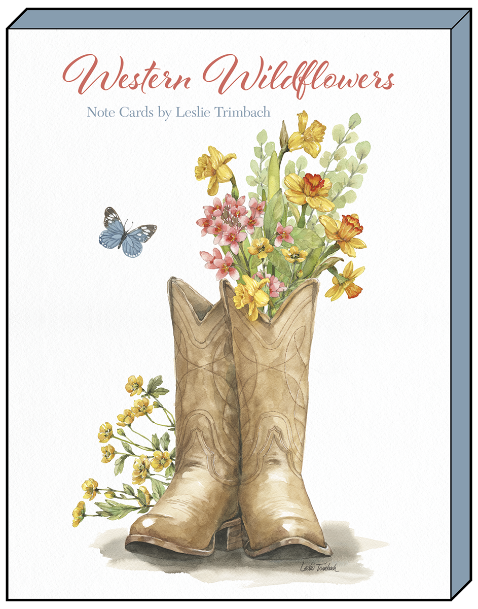 Front of a 'Western Wildflowers' note card by Leslie Trimbach, depicting tan cowboy boots filled with yellow daffodils and red flowers, with a blue butterfly.