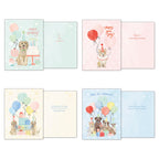 Detailed view of four unique dog birthday greeting card designs from the assortment, displaying both front illustrations of party dogs with balloons and gifts, and their individual heartfelt interior messages.