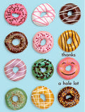 Vibrant thank you greeting card featuring a grid of twelve colorful, frosted donuts with sprinkles on a light blue background, playfully stating 'thanks a hole lot' in white text, perfect for expressing appreciation in a fun way.