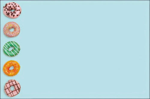 Blank inside of a cheerful greeting card, showing a vertical stack of five colorful frosted donuts with sprinkles on the left against a light blue background, providing ample space for a personalized handwritten message.