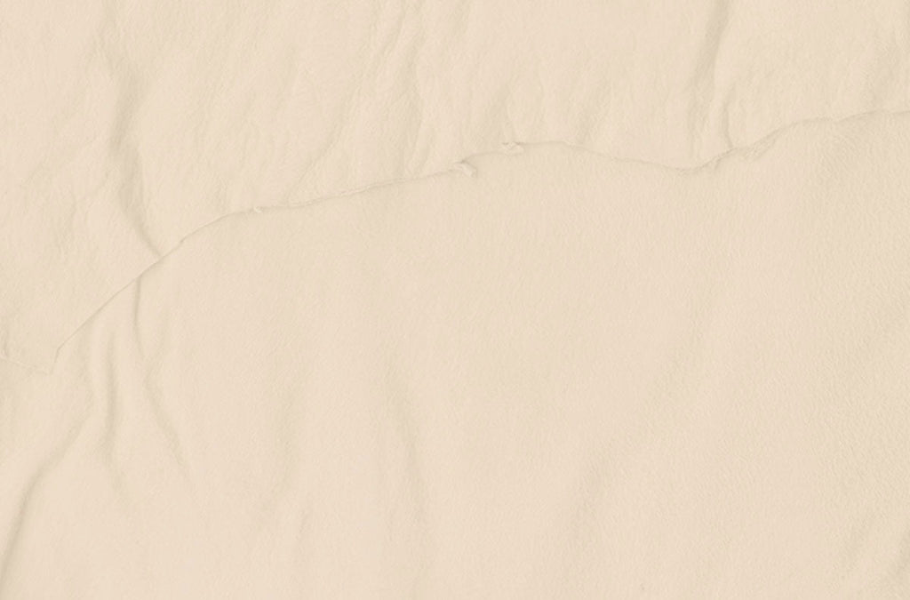 Subtle textured light cream-colored paper background, ideal for elegant stationery and card designs.