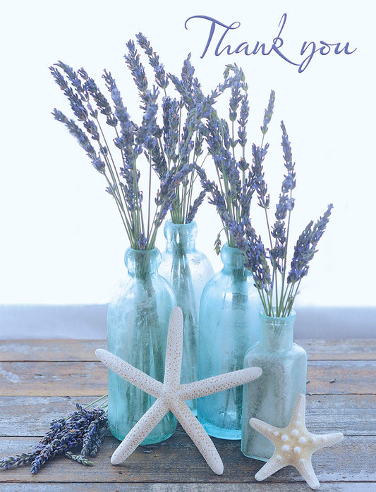 Elegant thank you card with purple lavender flowers in blue glass vases & white starfish on a rustic wooden surface. Perfect for gratitude.