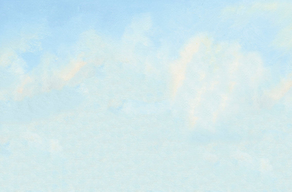 Soft blue sky with wispy white clouds, a serene and calming background for a thoughtful greeting card.