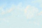 Soft blue sky with wispy white clouds, a serene and calming background for a thoughtful greeting card.