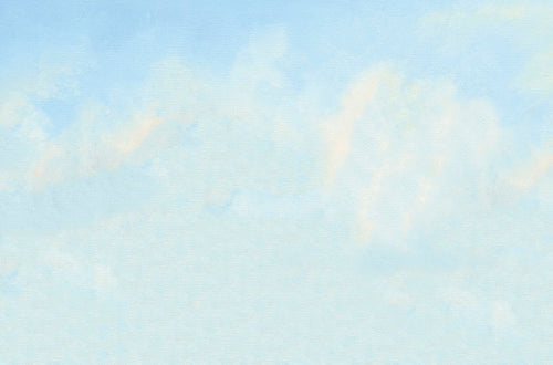 Soft blue sky with wispy white clouds, ideal for a peaceful greeting card background.