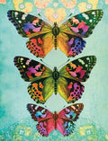 Vibrant trio of monarch-like butterflies with colorful wings (orange, purple, green, blue) against a teal and gold mandala-patterned background, showcasing artistic greeting card design.