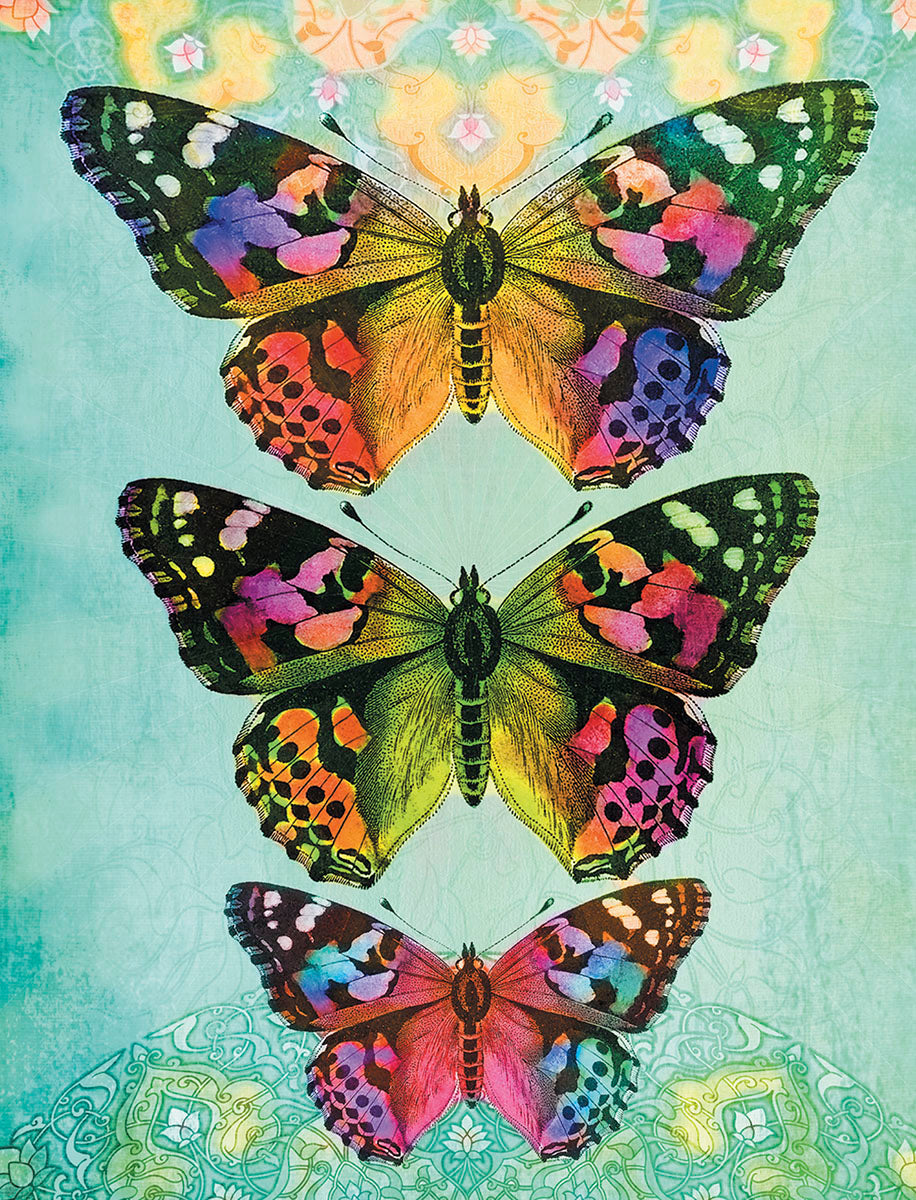 Vibrant trio of monarch-like butterflies with colorful wings (orange, purple, green, blue) against a teal and gold mandala-patterned background, showcasing artistic greeting card design.