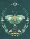 Close-up of an elegant, artistic greeting card featuring a vibrant green and gold butterfly illustration surrounded by a whimsical wreath of ferns, delicate flowers, and mystical mushrooms on a deep teal background. Perfect for thoughtful messages to loved ones.