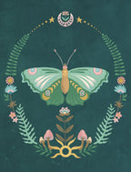 Close-up of an elegant, artistic greeting card featuring a vibrant green and gold butterfly illustration surrounded by a whimsical wreath of ferns, delicate flowers, and mystical mushrooms on a deep teal background. Perfect for thoughtful messages to loved ones.